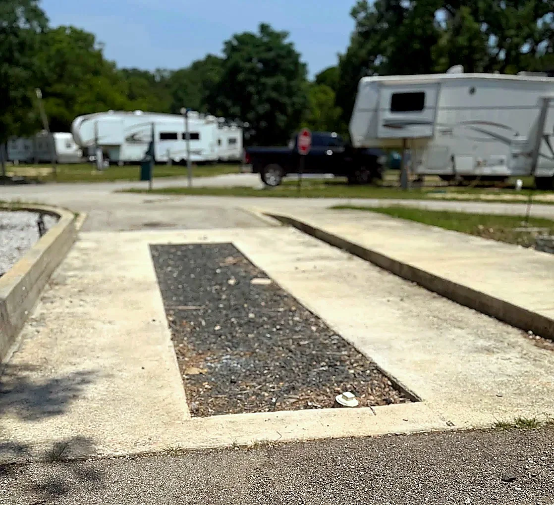 Shaded full-hookup RV site in San Marcos, Texas